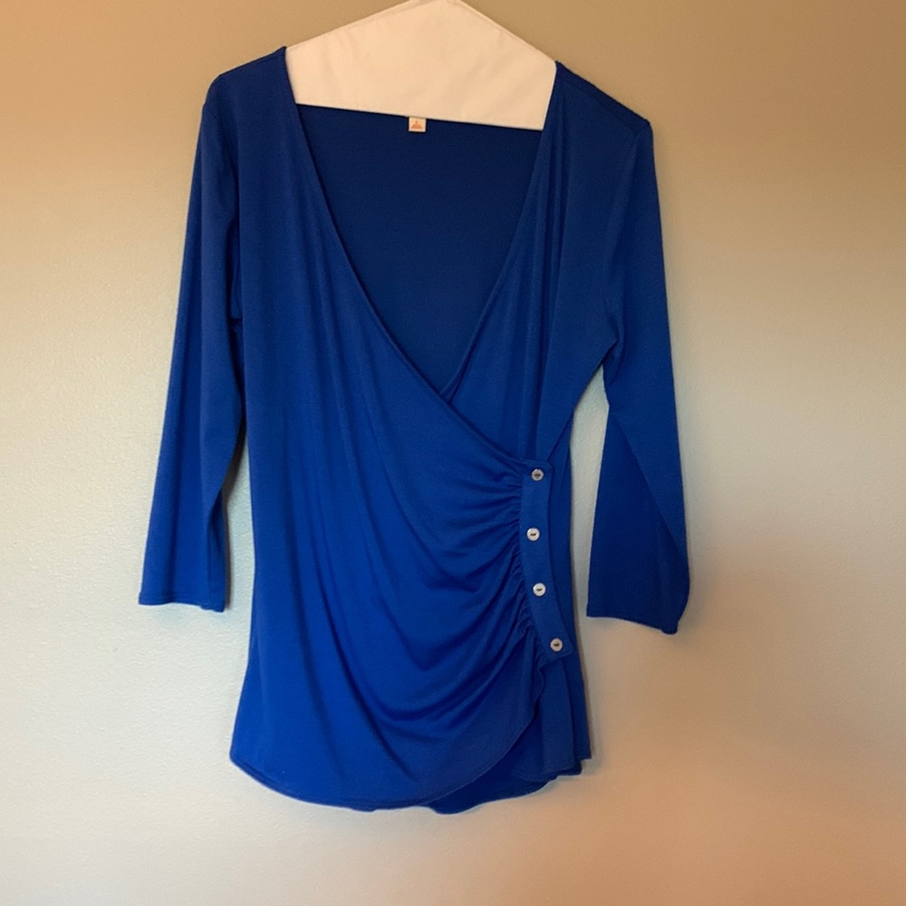 Soft blue 3/4 sleeve top; deep neckline